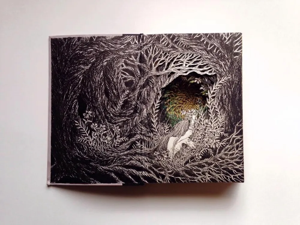 Des sculptures de scènes fantastiques dans des livres de Isobelle Ouzman des sculptures de scenes fantastiques dans des livres de isobelle ouzman 10 des-sculptures-de-scenes-fantastiques-dans-des-livres-de-isobelle-ouzman-10