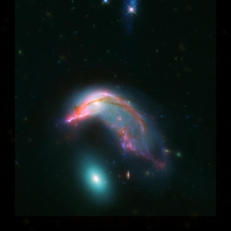 Une galaxie en forme de pingouin à côté d'une autre en forme d'œuf une galaxie en forme de pingouin a cote dune autre en forme d oeuf 1 une-galaxie-en-forme-de-pingouin-a-cote-dune-autre-en-forme-d-oeuf-1